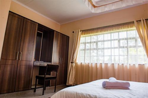 Kahiga Homestay Kahiga Homestay is a holiday home that is well positioned in Nyeri County in Kenya. https://kahigahomestay.com best accommodation best hotel world-class experiences for guests 5 spacious en-suite bedrooms nearby such as the Aberdare National Park, Mount Kenya National Park, Mau Mau Caves and the Italian War Memorial Church. Aberdare National Park Mount Kenya National Park Mau Mau Caves Italian War Memorial Church Mau Mau Italian Mount Kenya Mt. Kenya Mt Kenya Garden Gardens The tranquil lush mature gardens covered by tree canopies Wedding grounds Wedding Weddings